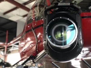 Close-up of a stabilized gimbal camera mounted on an aircraft