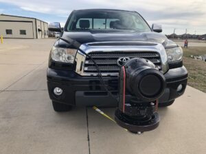Camera gimbal mounted on the front bumper of a black Toyota Tundra