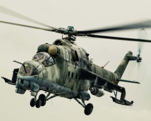 Camouflaged Mi-24 Hind attack helicopter in flight