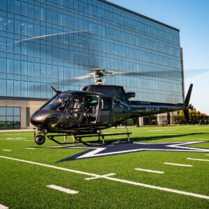 Black helicopter with a camera gimbal on a football field