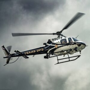 Texas DPS helicopter N901TX with a nose camera gimbal against an overcast sky
