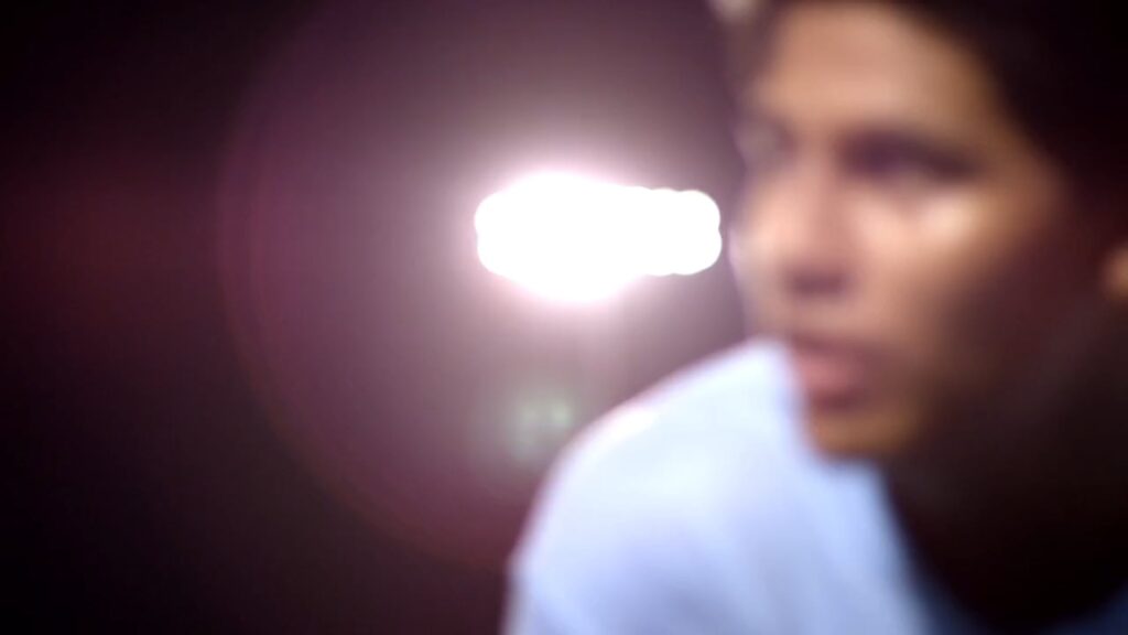 Out-of-focus portrait with a bright lens flare
