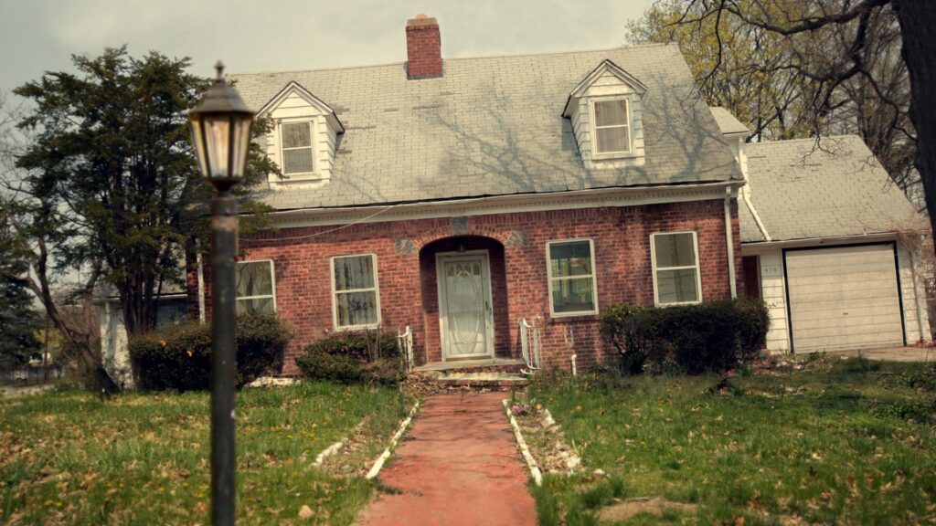 Brick house exterior lit at dusk