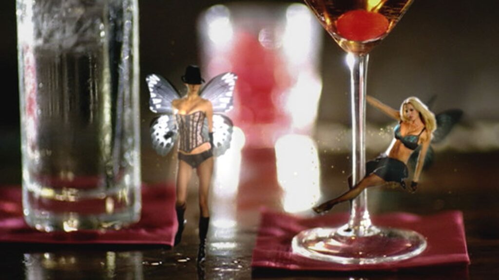 Cocktail glasses styled with small figurines