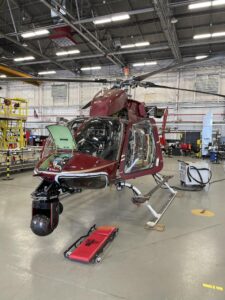 Helicopter in a maintenance hangar being prepped for a shoot