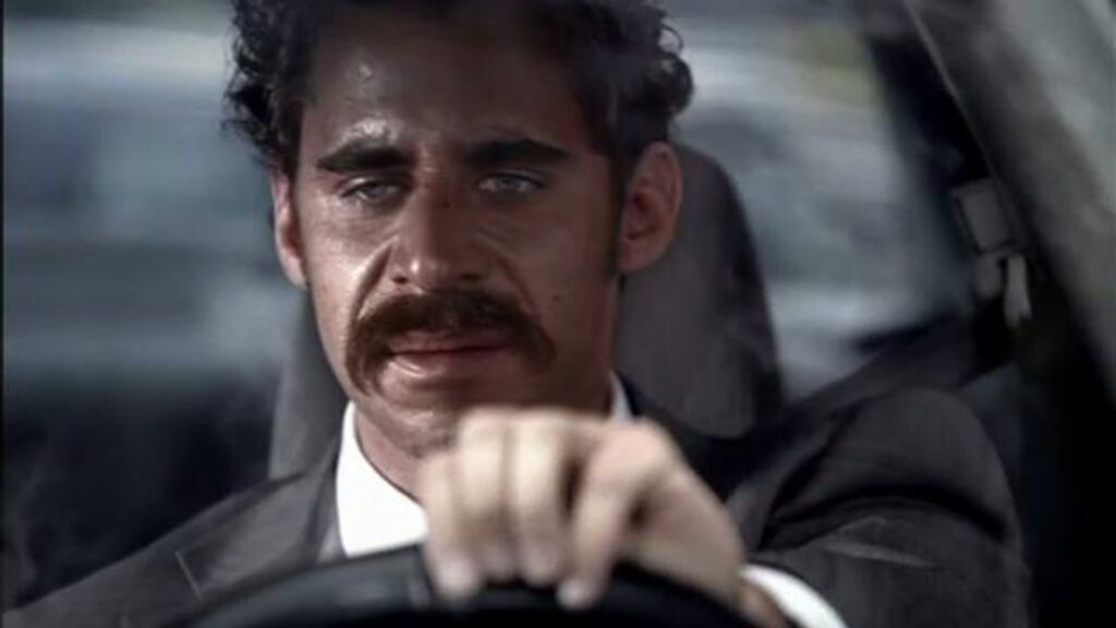 Close-up of a man in a suit in dramatic side light