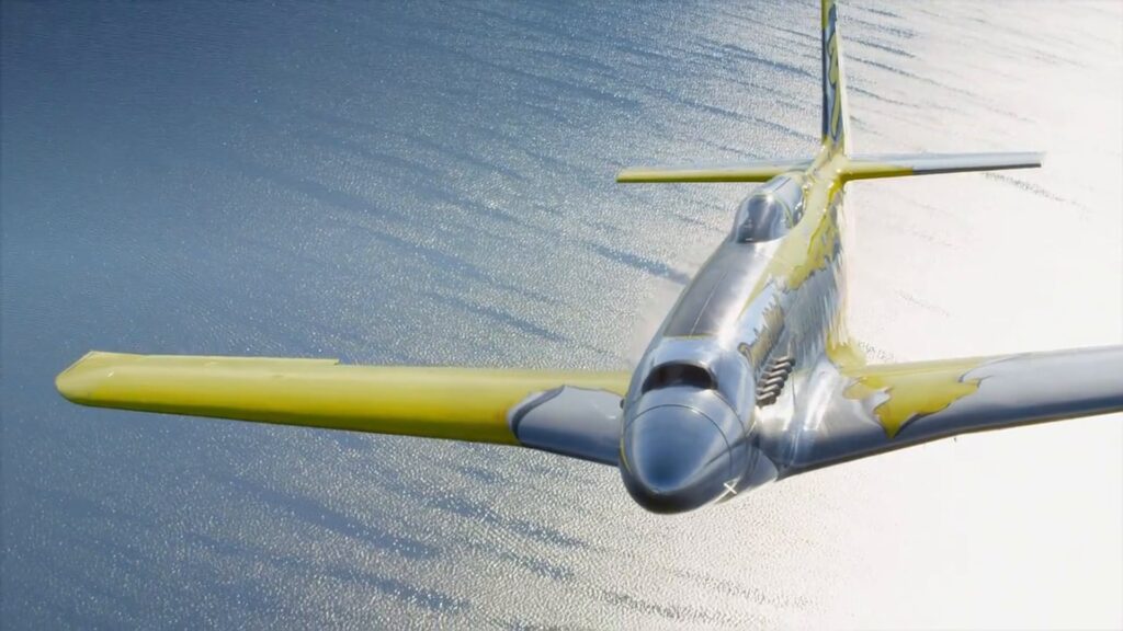 P-51 Mustang banking over open water during aerial photography