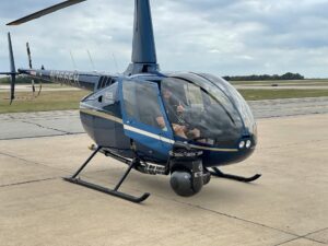 Robinson R44 helicopter parked on the ramp