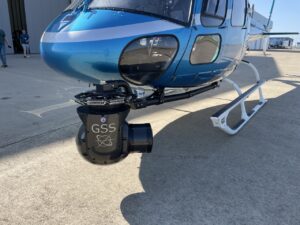 Blue helicopter on the ramp with a GSS gimbal on the nose